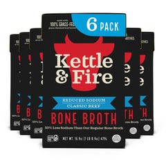 Kettle & Fire Reduce Sodium Beef Bone Broth bottle poured for quick meals.