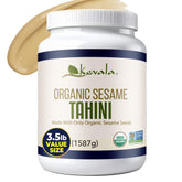 Kevala Organic Tahini bottle pour highlights smooth, nutty drizzle ideal for hummus and dressings.