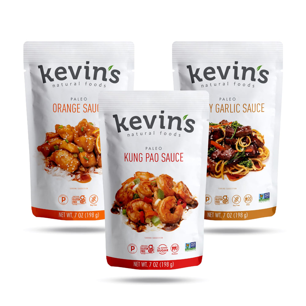 Kevin's Natural Foods orange simmer sauce bottle—quick stir-fry glaze option.