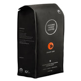 Kicking Horse Smart Ass coffee beans close-up highlighting rich aroma.