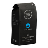 Kicking Horse Three Sisters coffee beans close-up for a balanced morning brew.