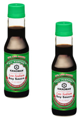 Kikkoman Less Sodium Soy Sauce bottles two-pack on pantry display for convenient cooking