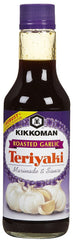 Kikkoman Roasted Garlic Teriyaki Marinade bottle pour; ideal for quick chicken, beef, or pork marinades.