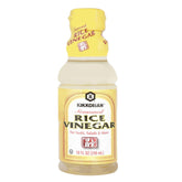 Kikkoman Seasoned Rice Vinegar bottle pouring, adding balanced acidity to everyday dishes.