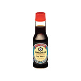 Kikkoman Naturally Brewed Soy Sauce bottle pour enhances savory meals.
