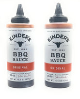Kinder's Original BBQ marinade bottle on the grill, ideal for adding smoky glaze.