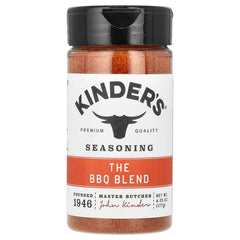 Kinder's Rub The BBQ Blend jar on a wooden table for seasoning.