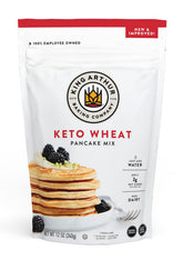 King Arthur Keto Wheat Pancake Mix bottle pour shows easy water-to-batter prep for fluffy breakfasts.