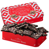 Kiri & Sons dark chocolate peppermint bark in a festive tin, ideal for gifting.