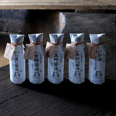 KISHIBORISHOYU mash-pressing captures fresh mash being pressed for flavor.