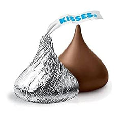 Close-up of foil-wrapped KISSES with creamy milk chocolate.