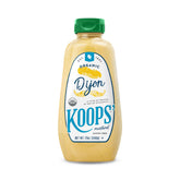 KOOPS' Organic Dijon Mustard bottle pouring for a tangy sandwich topping.