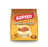 Kopiko Brown Coffee sachet poured into hot water for a bold cup.