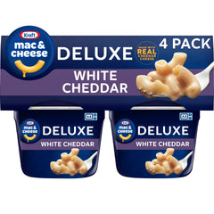 Kraft Deluxe Mac and Cheese Cups packaging on store shelf for quick meals.