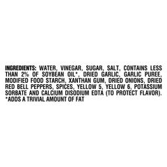 Kraft Zesty Italian Fat Free dressing being poured for easy portions.