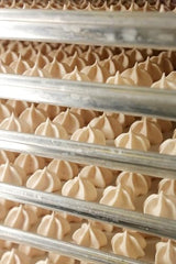 Krunchy Melts vanilla meringue cookies on plate, ready for a quick sweet break.