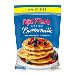 Krusteaz pancakes cooking on a hot griddle with a light aroma.
