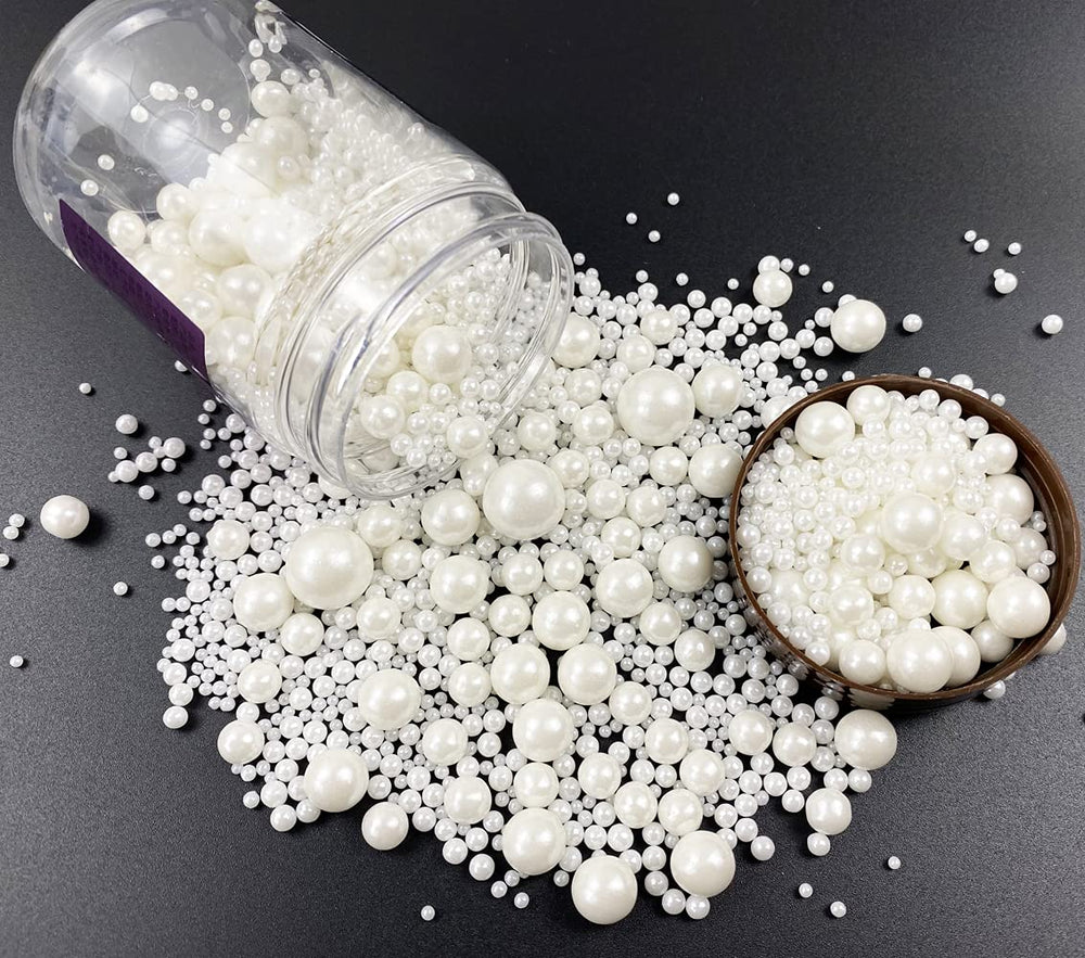 Kuting edible pearl sugar sprinkles in a shaker jar for festive cake decorating