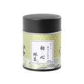 KYOHAYASHIYA ceremonial matcha powder sits in a jar for authentic rituals.