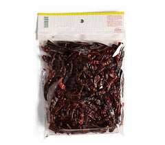 La Fiesta Toasted Arbol Chile Pods on a cutting board for salsa-base heat.
