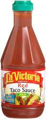 La Victoria Red Taco Sauce Mild bottle on a kitchen counter for quick tacos.