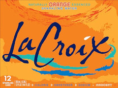 La Croix Orange sparkling water being poured into a glass – inviting bubbles and aroma.
