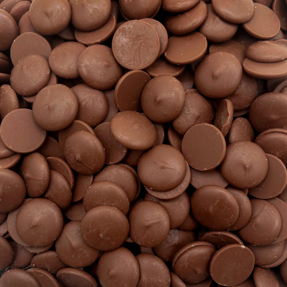 LAETAFOOD Merckens Milk Chocolate Melting Wafers in a 2 lb bag for smooth, even coatings.