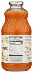Lakewood carrot-ginger-turmeric juice being poured into a glass with no added sugar.