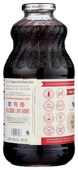 Lakewood Organic Pure Cherry Tart Juice poured into a glass for refreshing enjoyment.