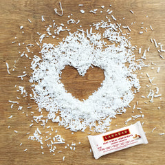 Larabar Coconut Cream Pie bar bite illustrating creamy coconut texture.