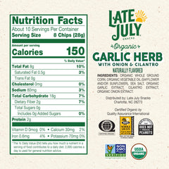 Close-up of Late July Garlic Herb Tortilla Chips showing thin crispy texture.