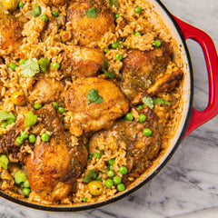 Lawry's Casero Adobo Without Pepper shaker dispensing spice onto food.