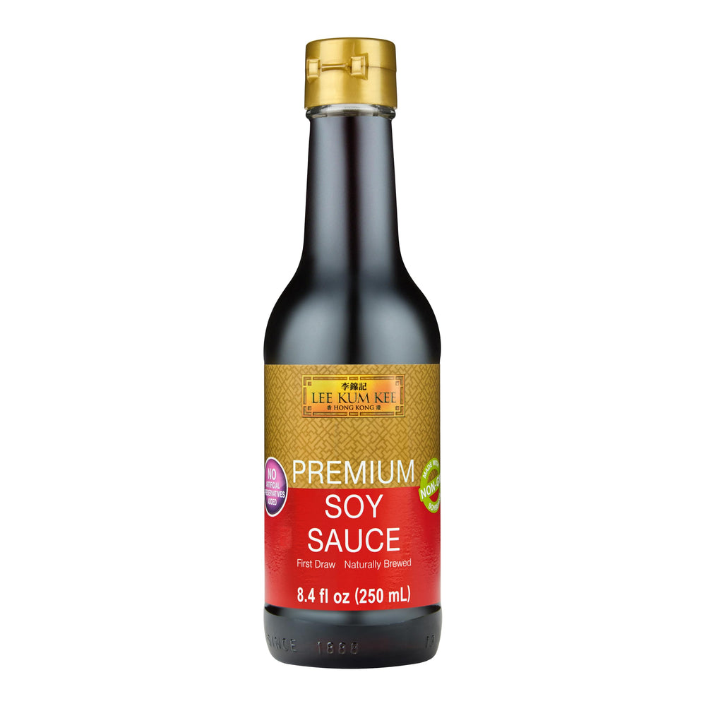 Lee Kum Kee Premium Soy Sauce bottle being poured for rich flavor.