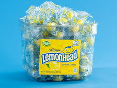 Close-up of Lemonhead candies showing crunchy texture and lemon juice flavor