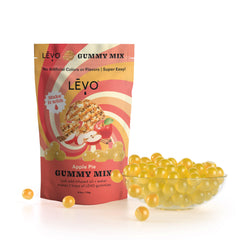 LEVO hand pouring gummy mixture into silicone molds for consistent results