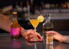 Liber & Co. Tropical Passion Fruit Syrup label emphasizing 50% real juice for richer drinks.