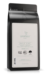 Lifeboost Half Caff coffee bag with cup, highlighting balanced aroma and flavor.