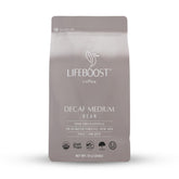 LIFEBOOST medium roast Swiss Water decaf coffee bag emphasizing rich flavor and low acidity