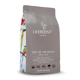 Lifeboost medium roast Swiss Water decaf ground coffee in a 12 oz bag for smooth brewing