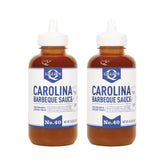 Lillie's Q Carolina BBQ Sauce bottle pouring to boost pork flavor