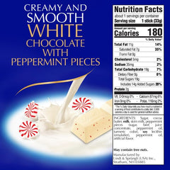 Lindt Classic Recipe White Chocolate Peppermint Stick broken to reveal smooth interior.