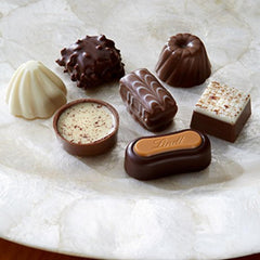 Lindt Creation Dessert lineup including brownie, eclair caramel, and tiramisu flavors