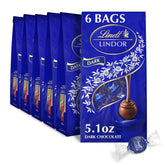 Lindt LINDOR dark truffles shell close-up showcases glossy shell and premium craftsmanship.