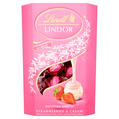 Lindt Lindor Strawberry & Cream truffle shell close-up, smooth melt perfect for gifting.