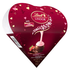 Lindt LINDOR Strawberry truffles in a friend heart box, ideal romantic gift for Valentine’s Day.