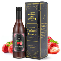 Liquid Alchemist strawberry syrup bottle being poured into a glass for cocktails