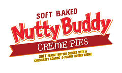 Little Debbie Nutty Buddy Creme Pies served with a glass of milk, a classic pairing.