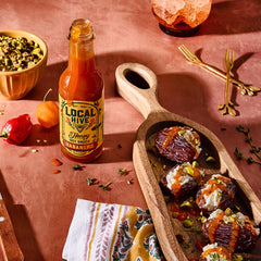 Local Hive Habanero Honey Hot Sauce on tacos delivering sweet heat.