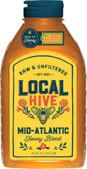 Local Hive Mid-Atlantic honey bottle on a kitchen counter for natural sweetening.