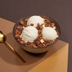 Close-up of dark and white chocolate chunks in Love Crunch granola.